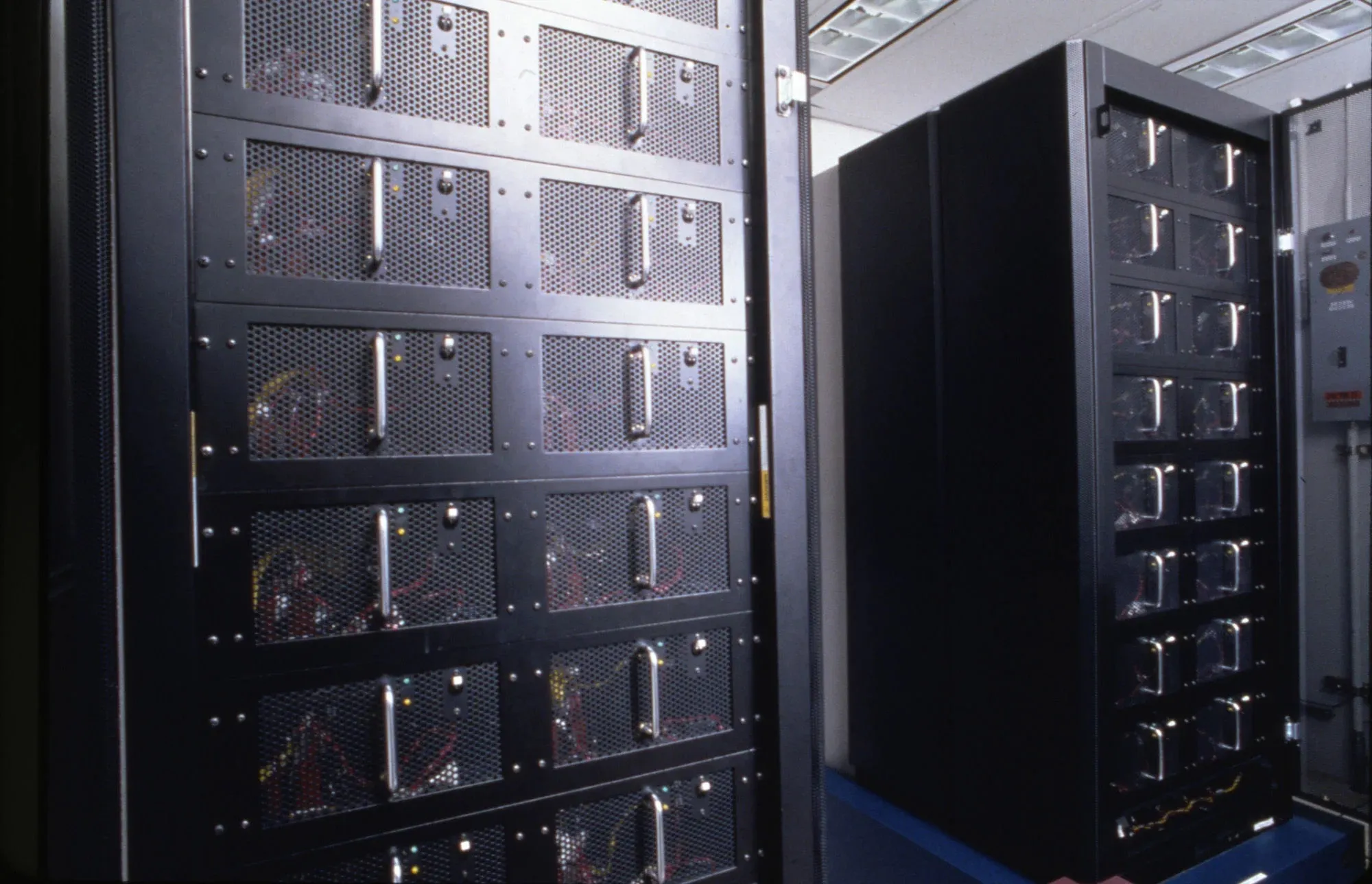 Rows of servers in black data-center cabinets