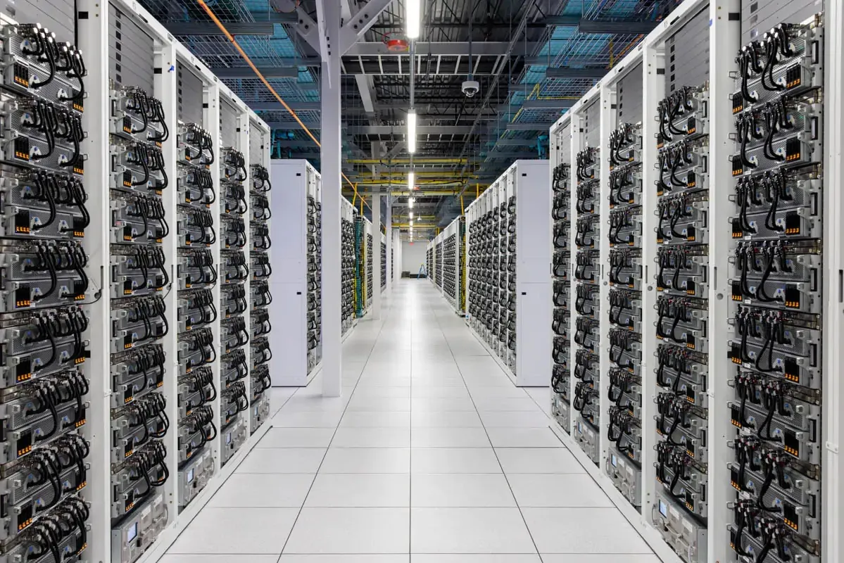 Rows of server racks in the xAI Colossus data center