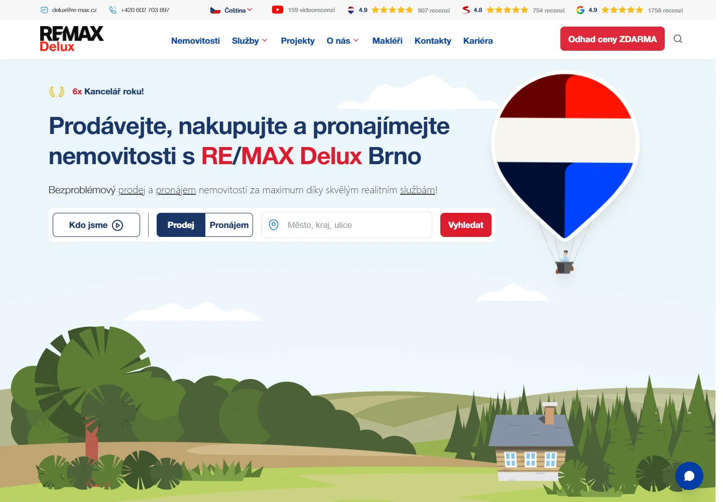 The RE/MAX Delux homepage with property search, a valuation link and an illustrated hot-air balloon
