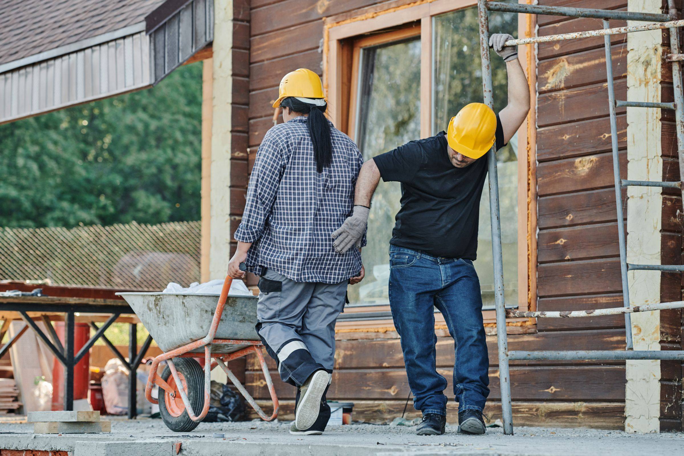 Workers on a construction site seen from behind