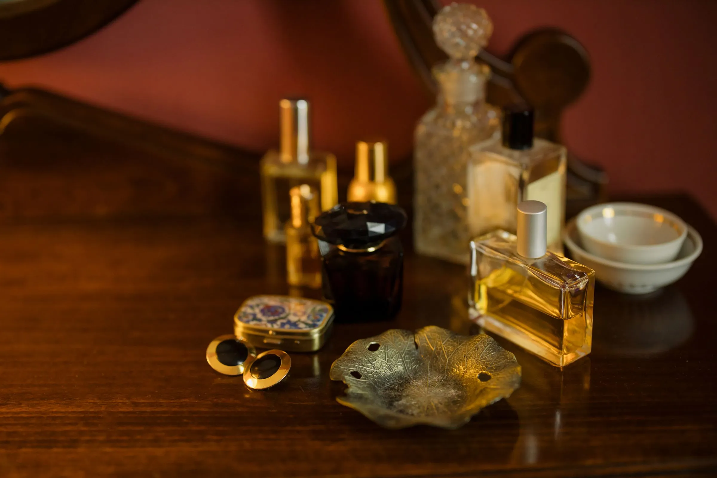 Perfume bottles on a dressing table in soft light