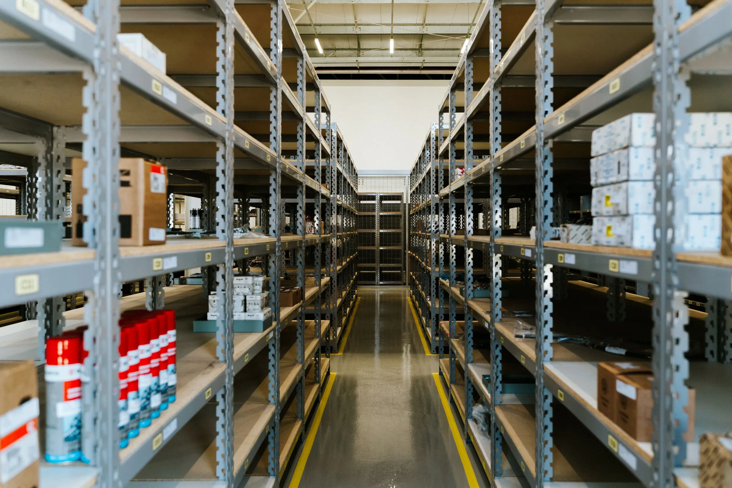 Rows of boxed goods on warehouse shelving